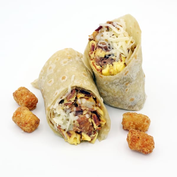Two breakfast burritos filled with eggs, meat, and cheese, served with tater tots on a white background.